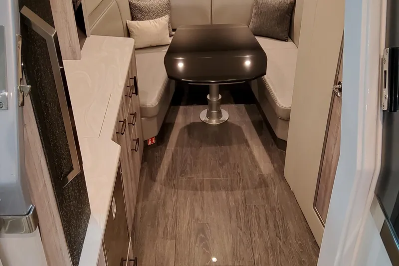 Slide: The Image of 2026 Formula 500 Super Sport Crossover interior with sleek seating and modern table design. - 6