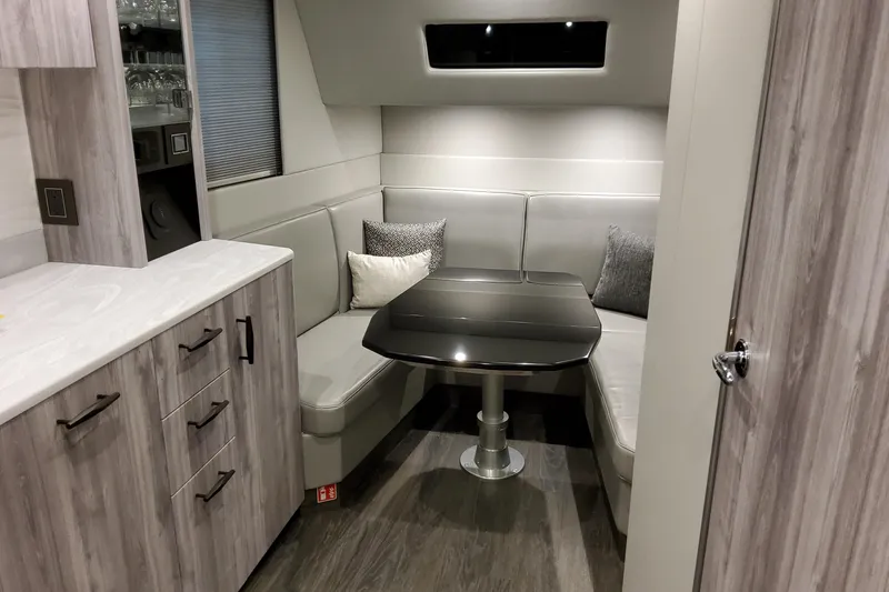 Slide: The Image of Interior of 2026 Formula 500 Super Sport Crossover with modern seating and sleek table design. - 7