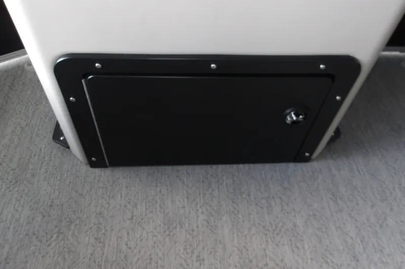Slide: The Image of Storage compartment on 2026 Sun Tracker Fishin' Barge 20 DLX boat interior. - 16