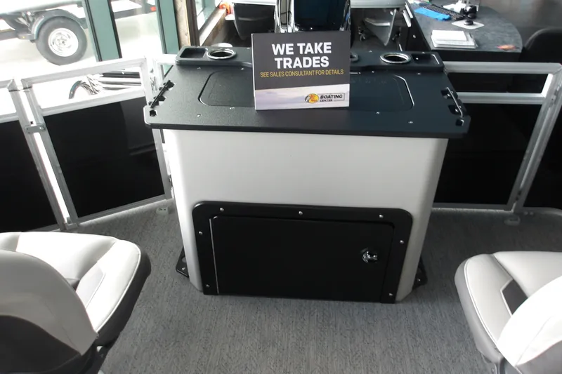 Slide: The Image of Interior of 2026 Sun Tracker Fishin' Barge 20 DLX with trade-in sign. - 14