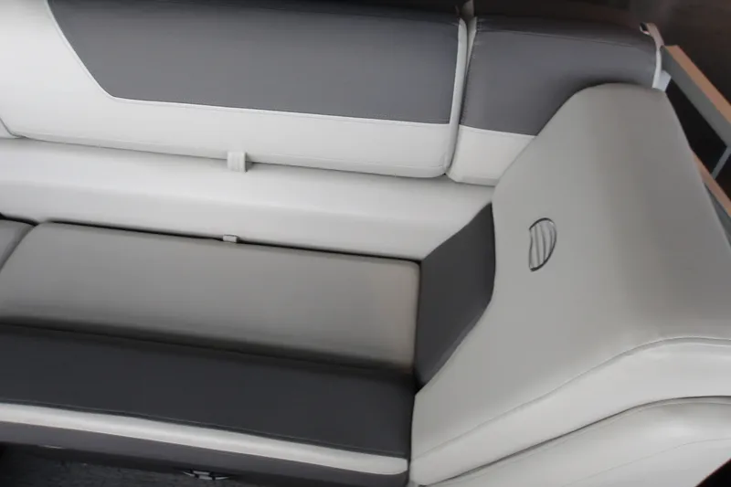 Slide: The Image of 2026 Sun Tracker Fishin' Barge 20 DLX interior seating, featuring gray and white upholstery. - 21