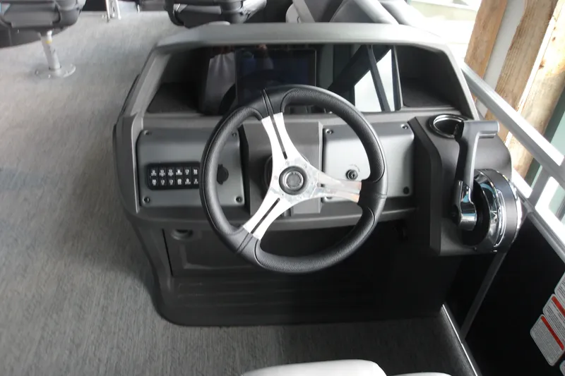 Slide: The Image of Steering console of 2026 Sun Tracker Fishin' Barge 20 DLX pontoon boat. - 18