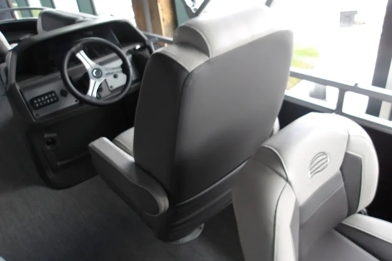 Slide: The Image of Interior view of 2026 Sun Tracker Fishin' Barge 20 DLX with steering wheel and seats. - 17