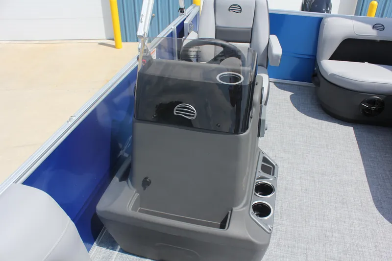 Slide: The Image of 2026 Sun Tracker Party Barge 16 DLX interior with steering console and seating. - 10