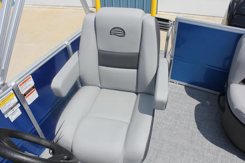 Slide: The Image of 2026 Sun Tracker Party Barge 16 DLX captain's chair with gray upholstery and armrests. - 14