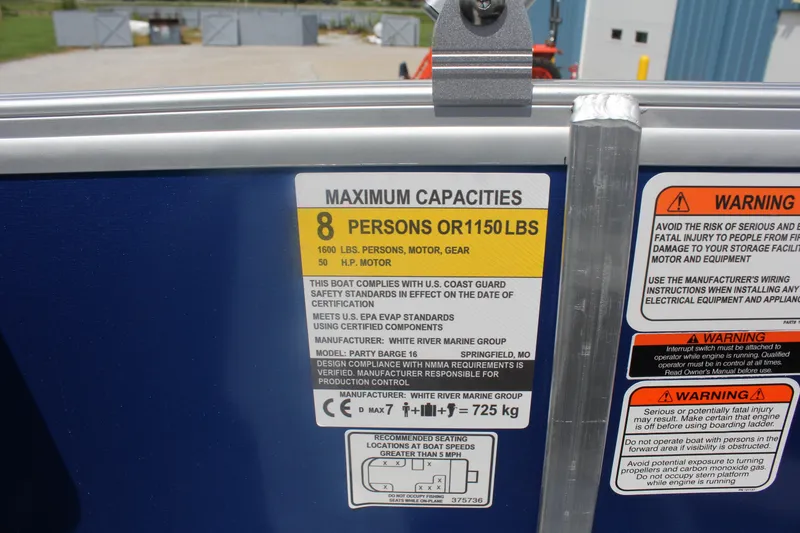 Slide: The Image of 2026 Sun Tracker Party Barge 16 DLX capacity label, 8 persons or 1150 lbs, safety warnings. - 15