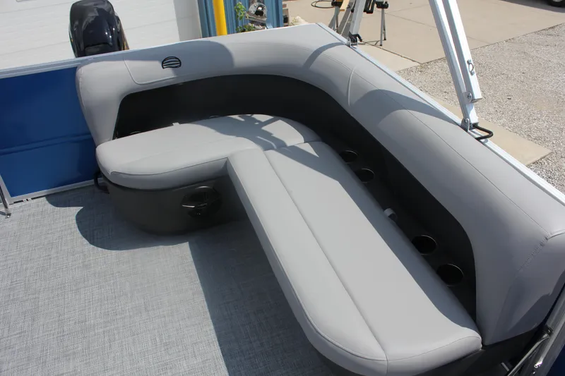 Slide: The Image of 2026 Sun Tracker Party Barge 16 DLX with gray seating and cup holders. - 16