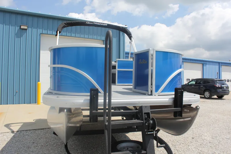 Slide: The Image of 2026 Sun Tracker Party Barge 16 DLX pontoon boat in a parking lot. - 4