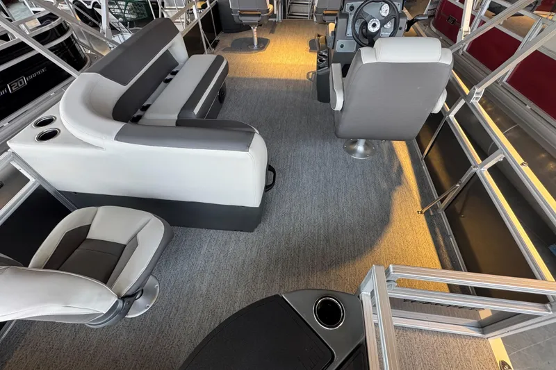 Slide: The Image of 2026 Sun Tracker Bass Buggy 18 DLX interior with seating and steering console. - 15