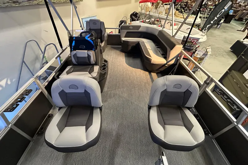 Slide: The Image of 2026 Sun Tracker Bass Buggy 16 XL Select pontoon boat interior with seating arrangement. - 2