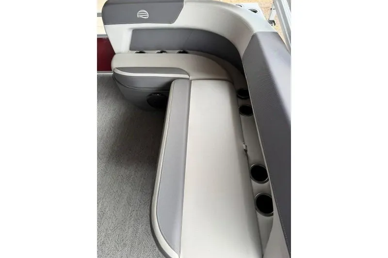 Slide: The Image of 2026 Sun Tracker Bass Buggy 16 XL Select boat seating with cup holders and gray upholstery. - 12