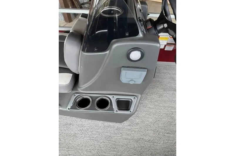 Slide: The Image of 2026 Sun Tracker Bass Buggy 16 XL Select console with cup holders and control panel. - 10
