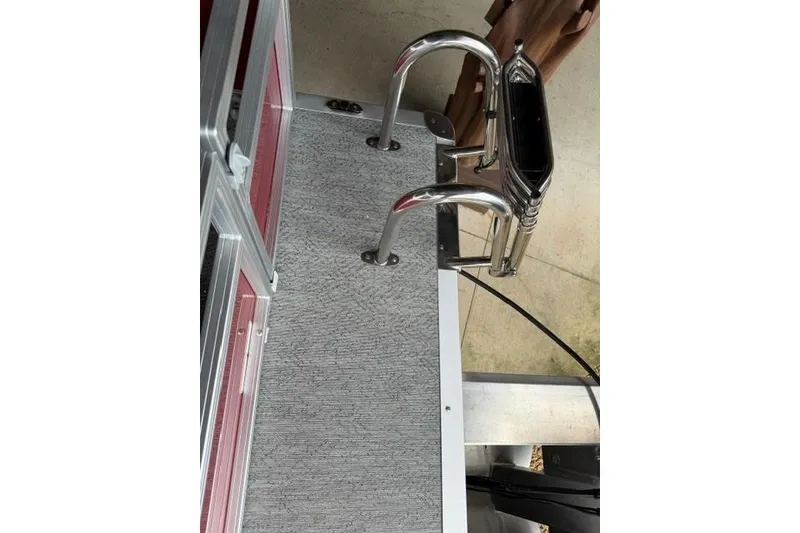 Slide: The Image of 2026 Sun Tracker Bass Buggy 16 XL Select boat deck with stainless steel railing. - 15