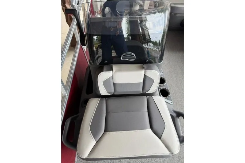Slide: The Image of 2026 Sun Tracker Bass Buggy 16 XL Select boat seats with modern design and cup holders. - 6