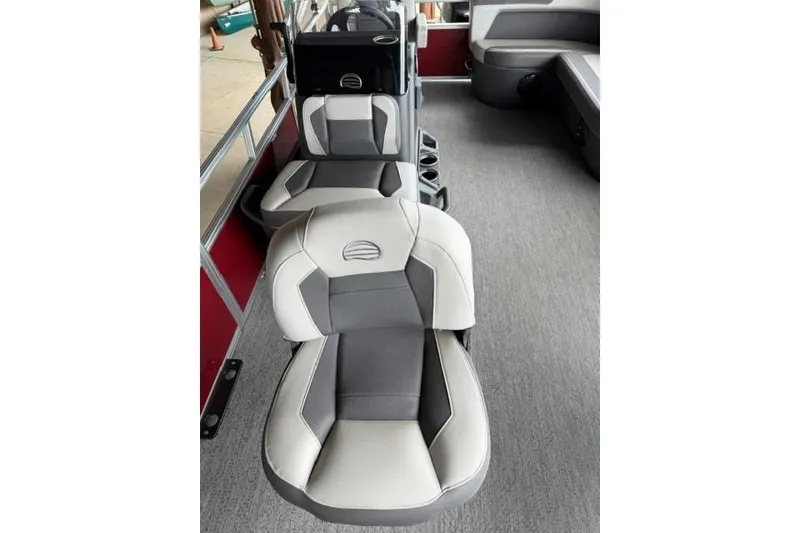 Slide: The Image of 2026 Sun Tracker Bass Buggy 16 XL Select boat interior with gray and white seating. - 8