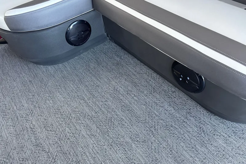 Slide: The Image of 2026 Sun Tracker Bass Buggy 16 XL Select interior with gray seating and integrated speakers. - 15