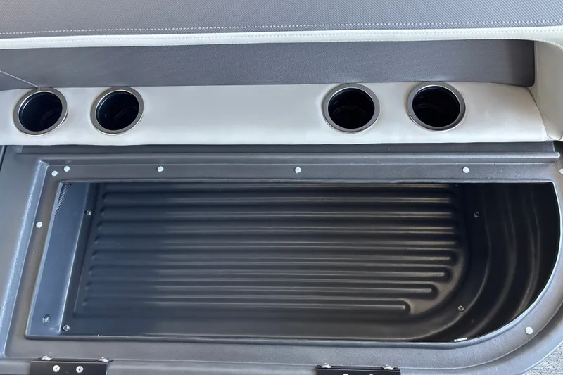 Slide: The Image of Interior of 2026 Sun Tracker Bass Buggy 16 XL Select with cup holders and storage compartment. - 14