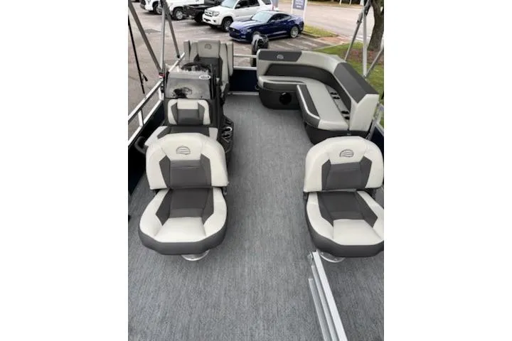 Slide: The Image of 2026 Sun Tracker Bass Buggy 16 XL Select pontoon boat interior with gray seating and spacious layout. - 3