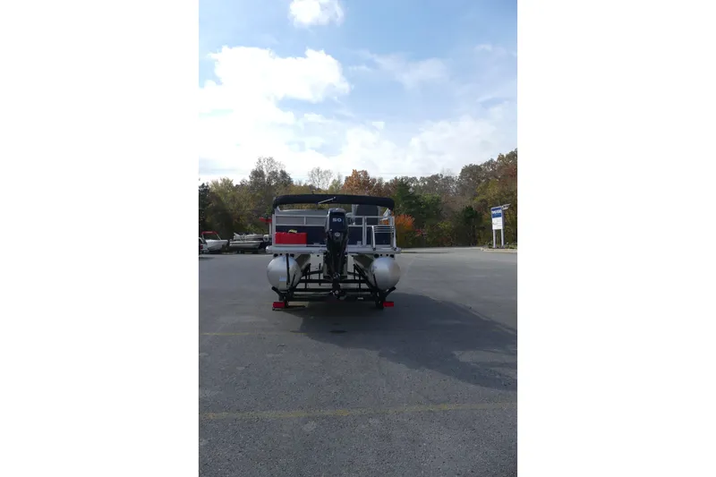 Slide: The Image of 2026 Sun Tracker Bass Buggy 16 XL Select pontoon boat in parking lot, rear view. - 73