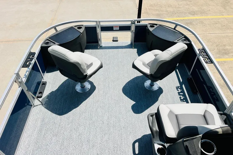 Slide: The Image of 2026 Sun Tracker Bass Buggy 18 DLX pontoon boat interior with swivel seats. - 12