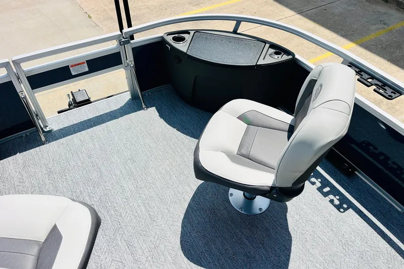 Slide: The Image of 2026 Sun Tracker Bass Buggy 18 DLX pontoon boat interior with seating and console. - 15