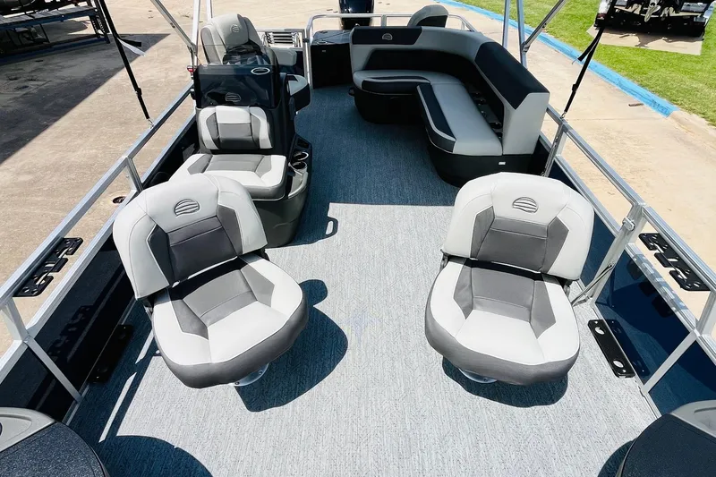 Slide: The Image of 2026 Sun Tracker Bass Buggy 18 DLX pontoon boat interior with comfortable seating. - 17