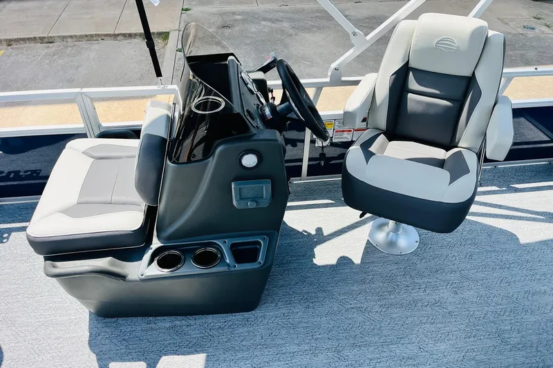 Slide: The Image of 2026 Sun Tracker Bass Buggy 18 DLX interior with steering console and seating. - 21