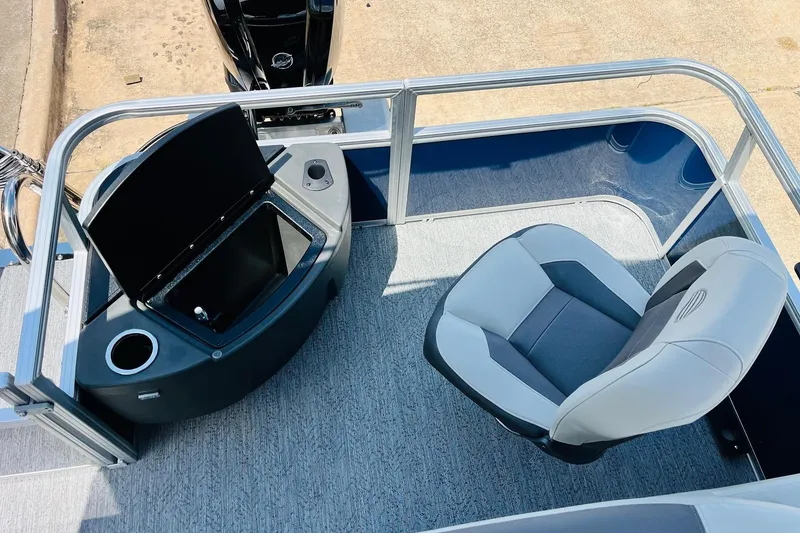 Slide: The Image of 2026 Sun Tracker Bass Buggy 18 DLX interior with seating and storage compartment. - 32