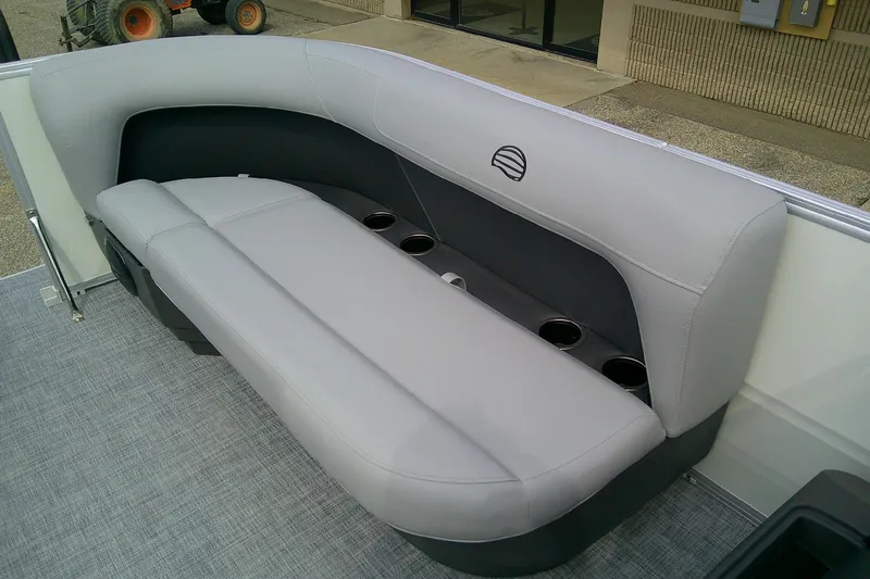 Slide: The Image of 2026 Sun Tracker Party Barge 16 DLX, gray seating with cup holders on a pontoon boat. - 5