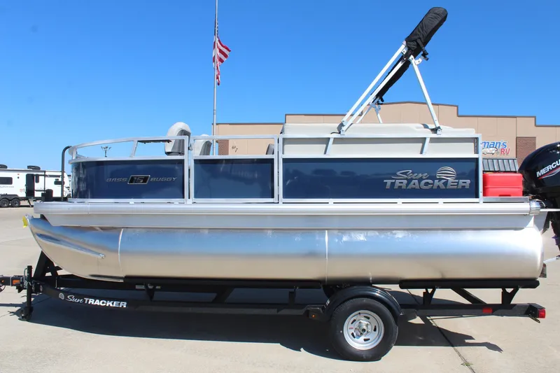 The Image of 2026 Sun Tracker Bass Buggy 16 XL Select pontoon boat on display outdoors. - 0