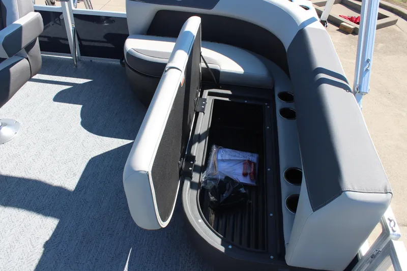 Slide: The Image of 2026 Sun Tracker Bass Buggy 16 XL Select pontoon boat with open storage compartment. - 16
