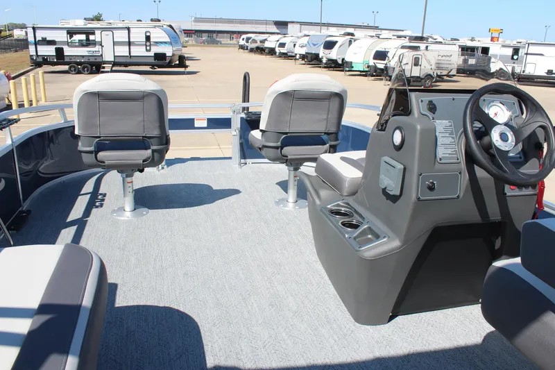 Slide: The Image of 2026 Sun Tracker Bass Buggy 16 XL Select pontoon boat interior with helm and seating. - 18