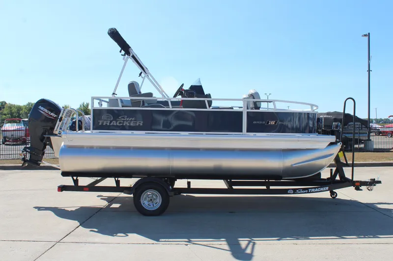 Slide: The Image of 2026 Sun Tracker Bass Buggy 16 XL Select pontoon boat at dealership. - 4