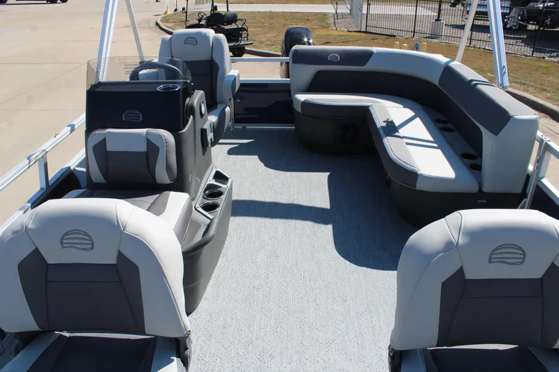 Slide: The Image of 2026 Sun Tracker Bass Buggy 16 XL Select pontoon boat interior with seating and helm. - 8