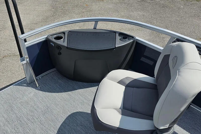 Slide: The Image of 2026 Sun Tracker Bass Buggy 18 DLX interior with seating and control panel. - 10