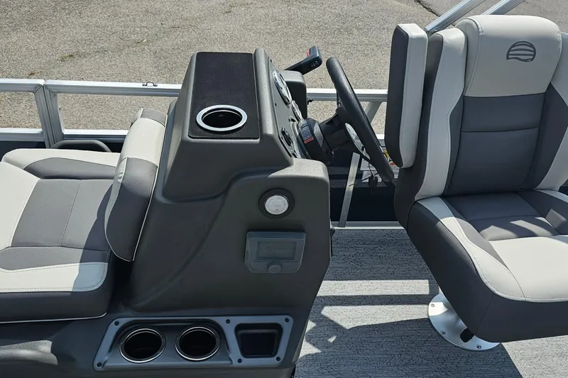Slide: The Image of 2026 Sun Tracker Bass Buggy 18 DLX interior with steering console and seating. - 15