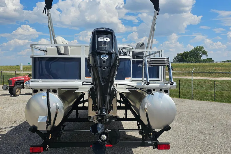 Slide: The Image of 2026 Sun Tracker Bass Buggy 18 DLX pontoon boat with 60 HP Mercury engine. - 3