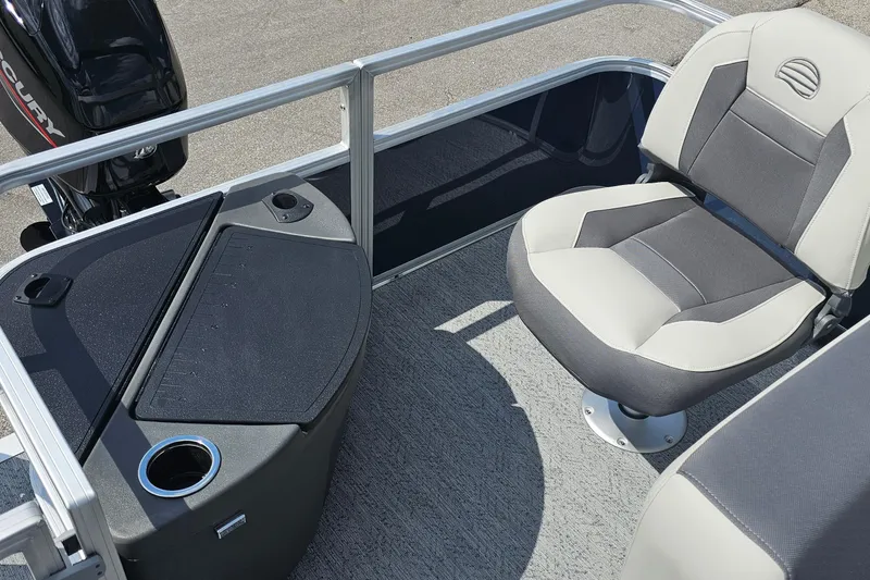 Slide: The Image of 2026 Sun Tracker Bass Buggy 18 DLX boat interior with seating and storage. - 8