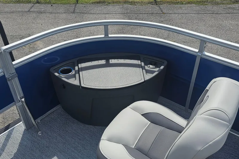 Slide: The Image of 2026 Sun Tracker Fishin' Barge 20 DLX interior with seating and storage area. - 10