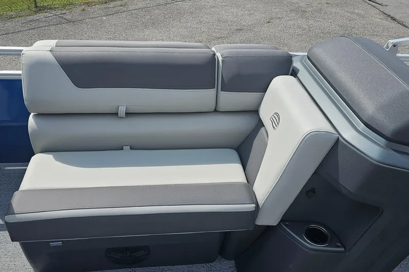 Slide: The Image of 2026 Sun Tracker Fishin' Barge 20 DLX boat seating, featuring gray and white upholstery. - 12