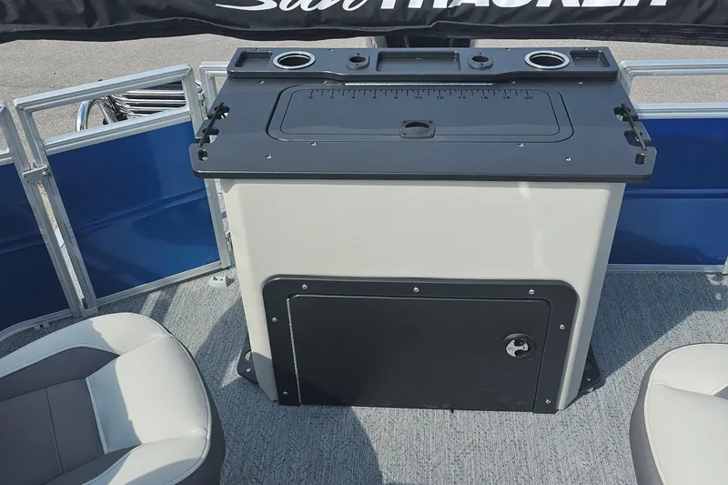 Slide: The Image of 2026 Sun Tracker Fishin' Barge 20 DLX interior with fishing station and seating. - 19