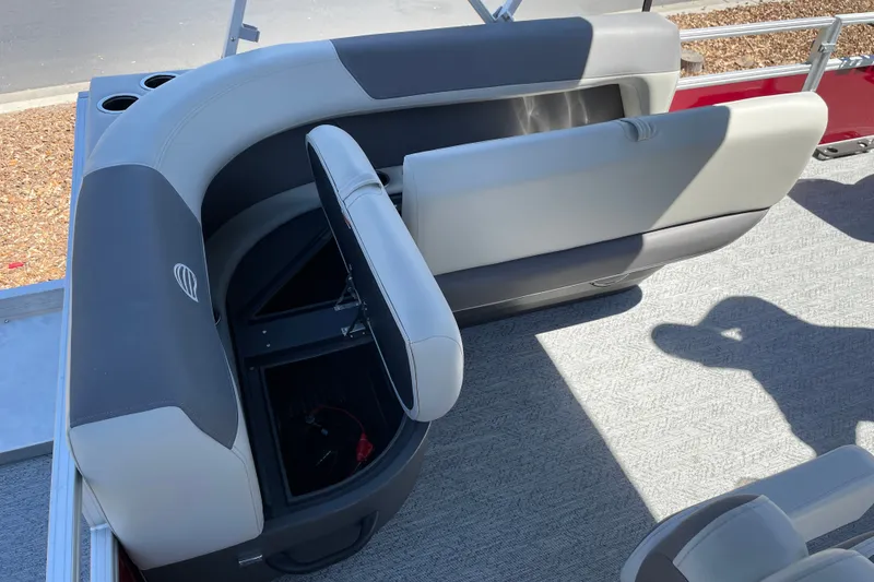 Slide: The Image of 2026 Sun Tracker Bass Buggy 16 XL Select boat seating with storage compartment open. - 18