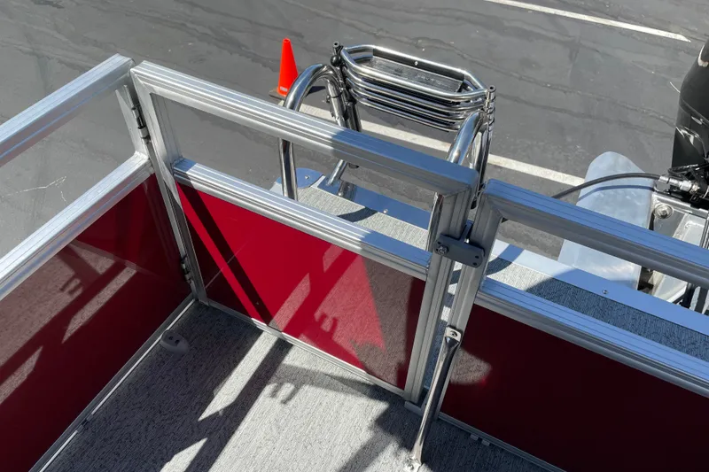 Slide: The Image of 2026 Sun Tracker Bass Buggy 16 XL Select boat deck with railing and ladder. - 22