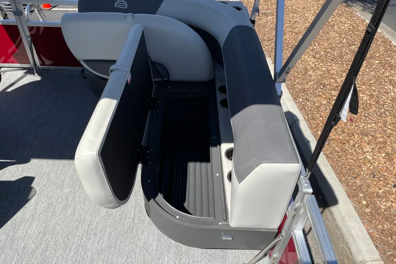 Slide: The Image of Open storage compartment on 2026 Sun Tracker Bass Buggy 16 XL Select pontoon boat. - 17