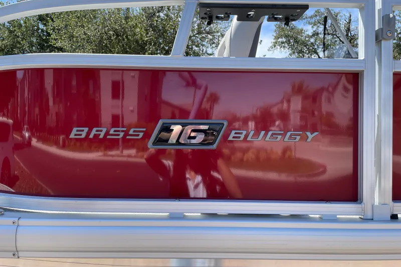 Slide: The Image of 2026 Sun Tracker Bass Buggy 16 XL Select, red exterior detail with logo. - 26