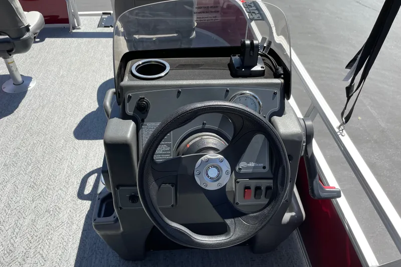 Slide: The Image of 2026 Sun Tracker Bass Buggy 16 XL Select steering console with gauges and controls. - 21