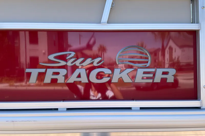 Slide: The Image of 2026 Sun Tracker Bass Buggy 16 XL Select logo on red background. - 27