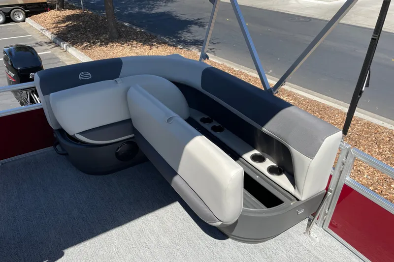 Slide: The Image of 2026 Sun Tracker Bass Buggy 16 XL Select pontoon boat seating area with cup holders. - 16