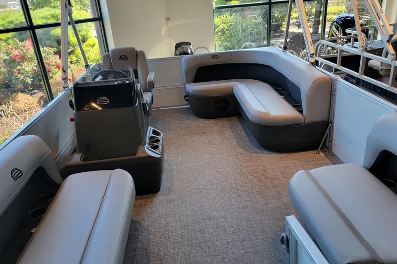 Slide: The Image of 2026 Sun Tracker Party Barge 16 DLX interior with spacious seating and modern design. - 2