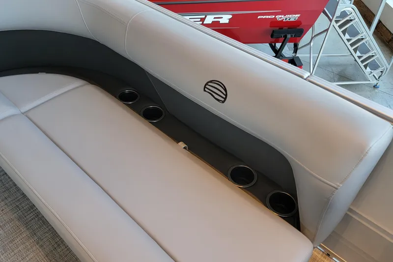 Slide: The Image of 2026 Sun Tracker Party Barge 16 DLX interior with cushioned seating and cup holders. - 47